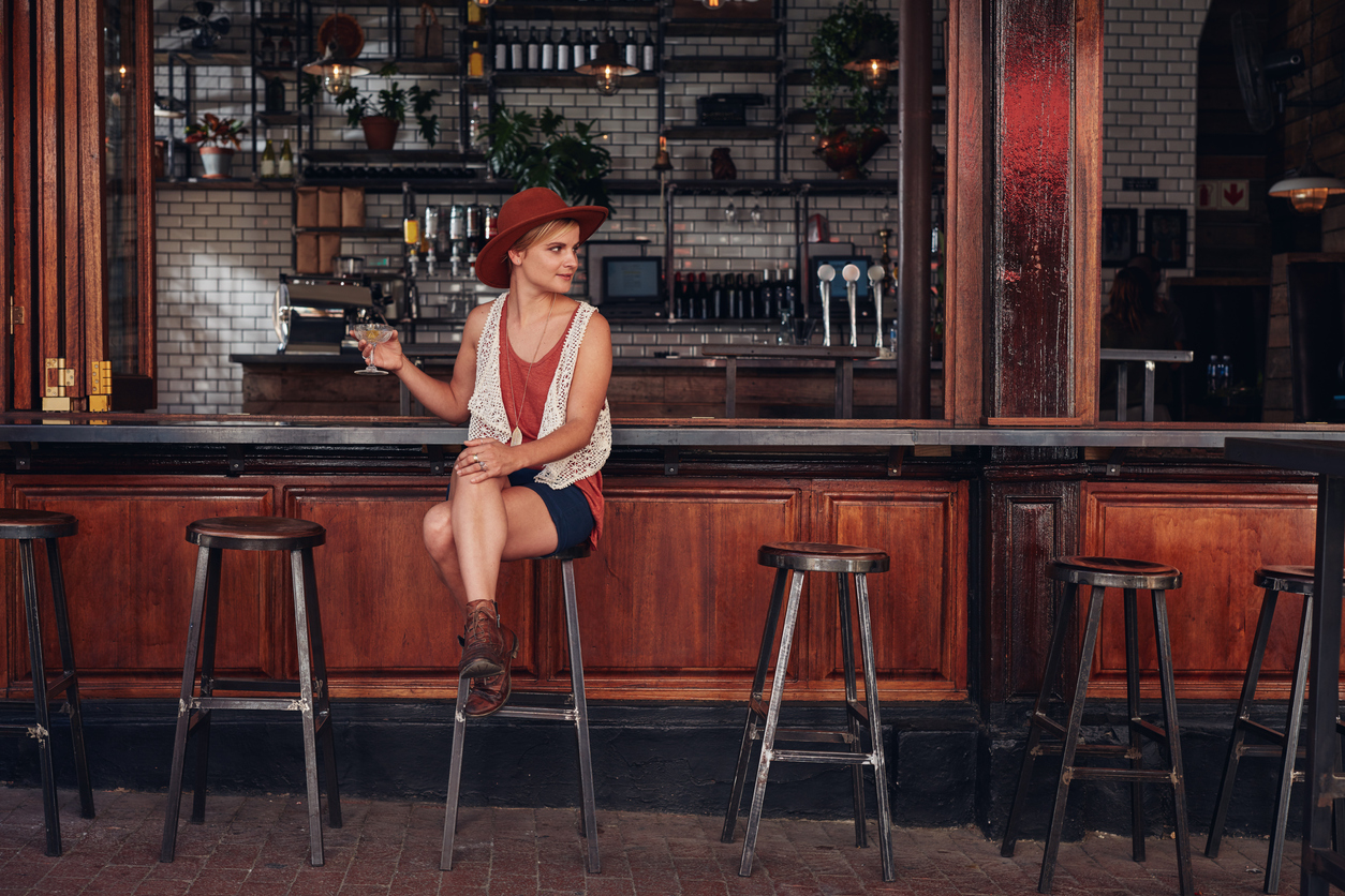 Woman sitting alone at a bar