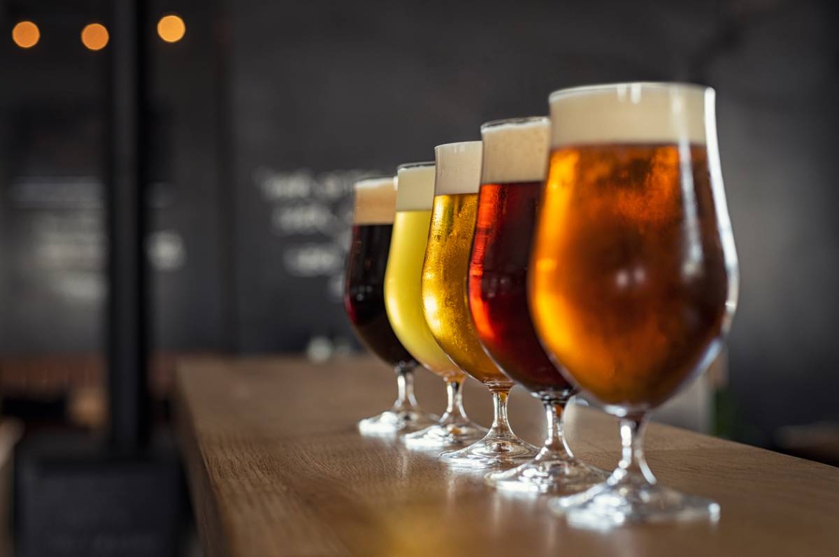 Line of draft beers on bar counter